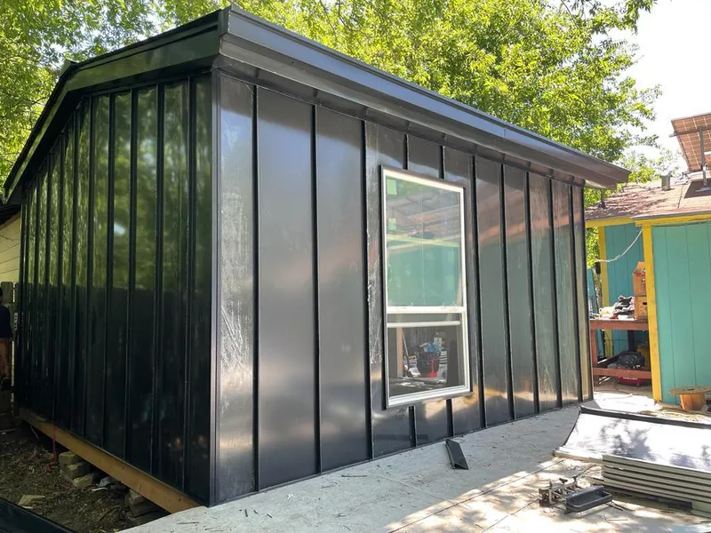 Black standing seam metal wall panels for Metal Roof Installation in Melissa